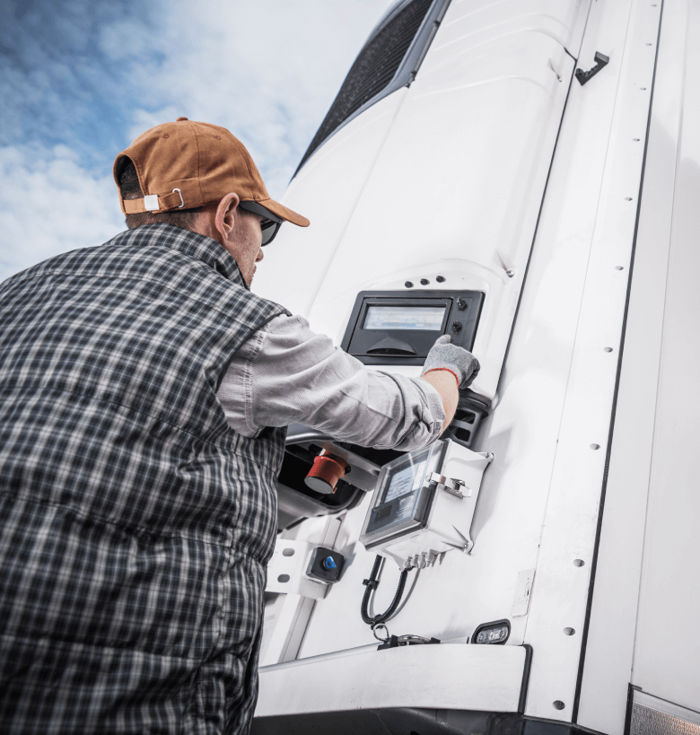 Man Adjusting a refrigerated truck